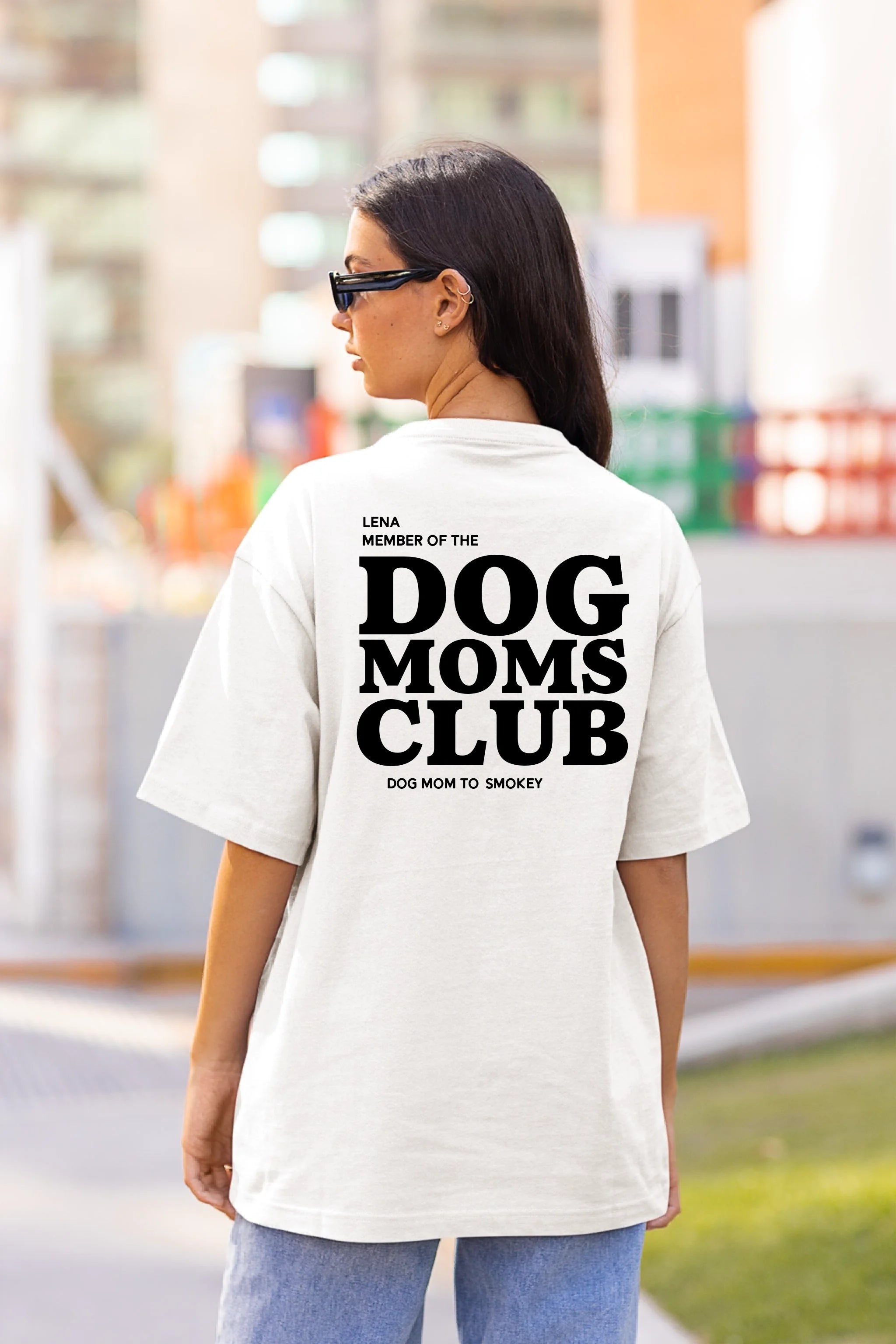 back-view-mockup-of-a-woman-in-an-oversized-t-shirt-on-the-street-m25267